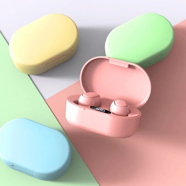 Wireless earbuds in pink charging case.